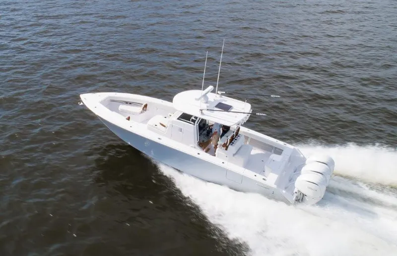  Yacht Photos Pics 2024 Jupiter 340LS boat cruising on open water with triple engines.