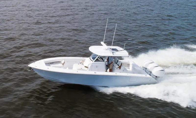  Yacht Photos Pics 2024 Jupiter 340LS boat cruising on open water, showcasing sleek design and powerful engines.