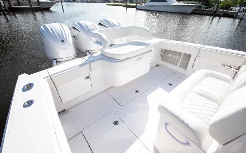  Yacht Photos Pics 2024 Jupiter 340LS boat interior with triple outboard engines, docked on a sunny day.