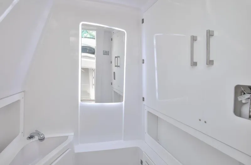  Yacht Photos Pics 2024 Jupiter 340LS boat interior, featuring sleek white cabinetry and modern fixtures.