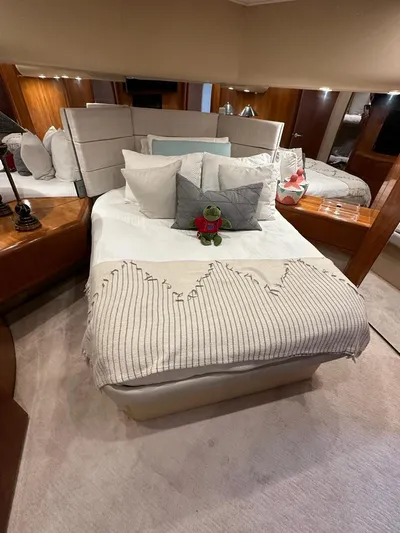  Yacht Photos Pics Luxurious bedroom in a 2001 Hatteras 60 Convertible yacht.