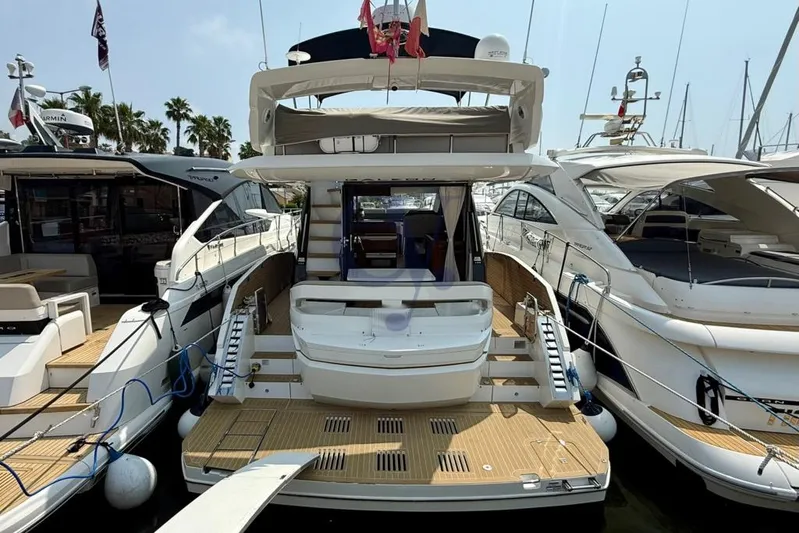  Yacht Photos Pics 2022 Galeon 460 Fly yacht docked at marina, showcasing luxurious design and spacious deck.