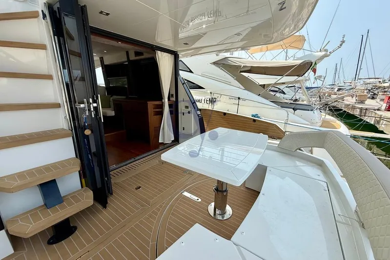  Yacht Photos Pics 2022 Galeon 460 Fly yacht with open deck, modern interior, and marina view.