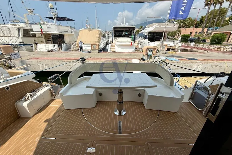  Yacht Photos Pics 2022 Galeon 460 Fly yacht deck with seating area at marina.