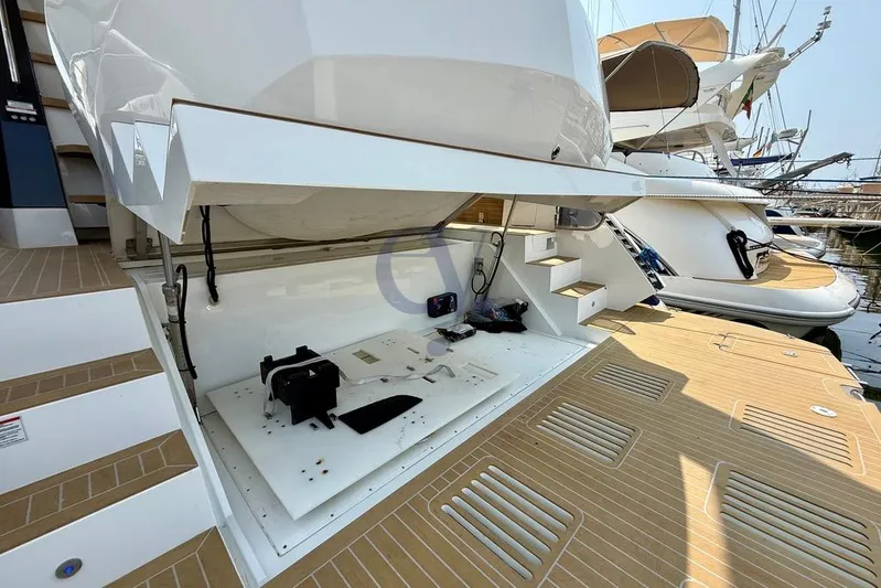  Yacht Photos Pics 2022 Galeon 460 Fly yacht with open storage compartment and teak deck.