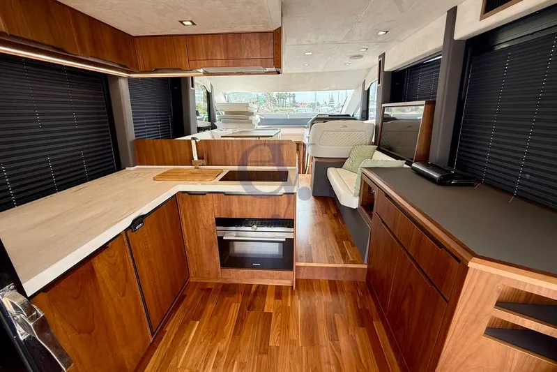  Yacht Photos Pics Luxurious interior of 2022 Galeon 460 Fly yacht with modern kitchen and seating area.