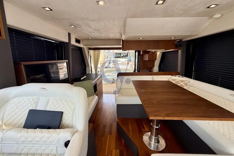  Yacht Photos Pics Luxurious interior of 2022 Galeon 460 Fly yacht with elegant seating and wooden table.