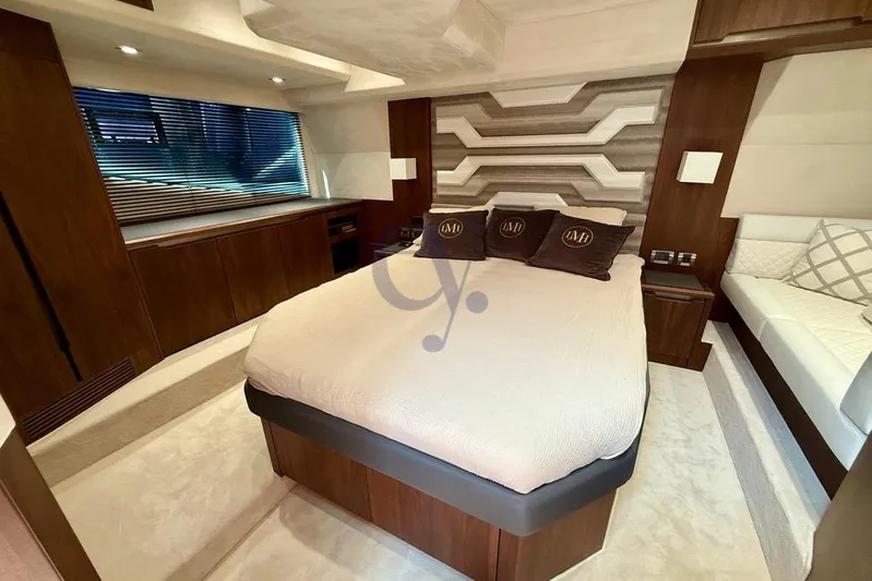 Yacht Photos Pics Luxurious bedroom interior of 2022 Galeon 460 Fly yacht with modern design elements.