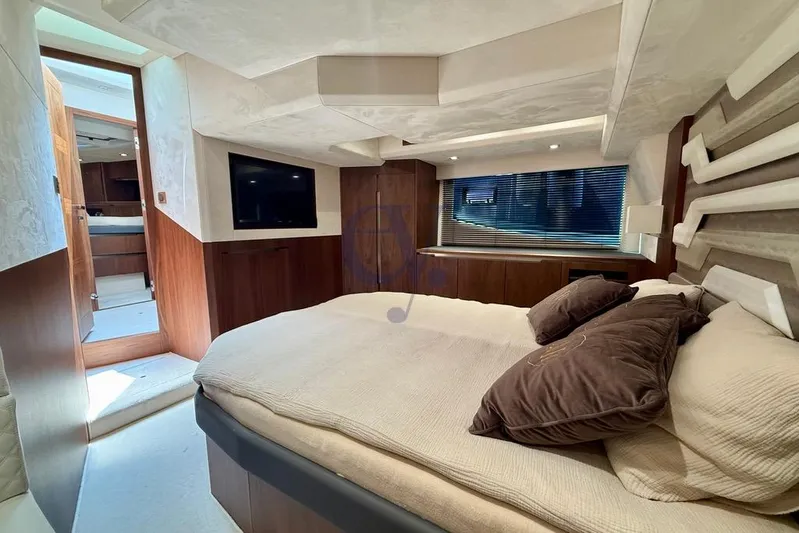  Yacht Photos Pics Luxurious bedroom interior of 2022 Galeon 460 Fly yacht with modern design and cozy bedding.