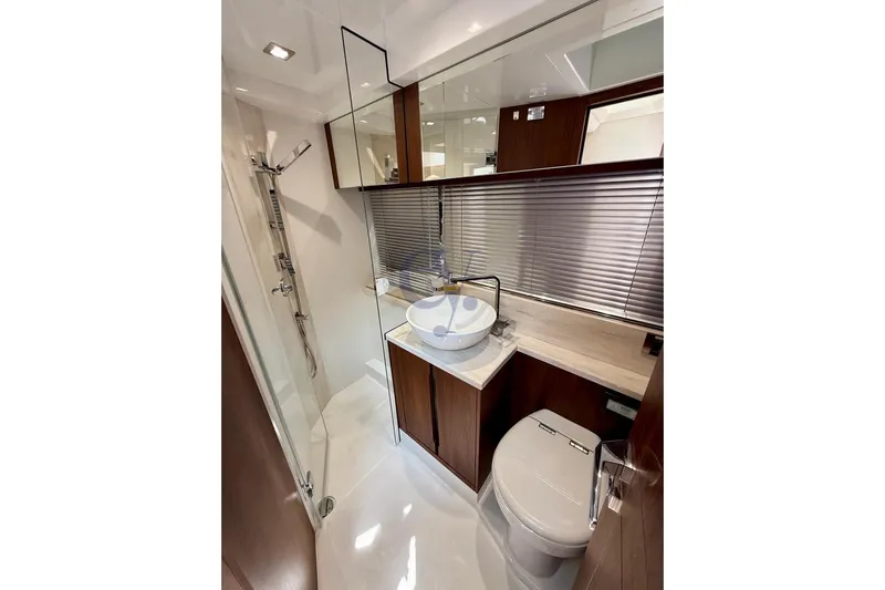  Yacht Photos Pics Luxurious bathroom in 2022 Galeon 460 Fly yacht with modern fixtures and elegant design.