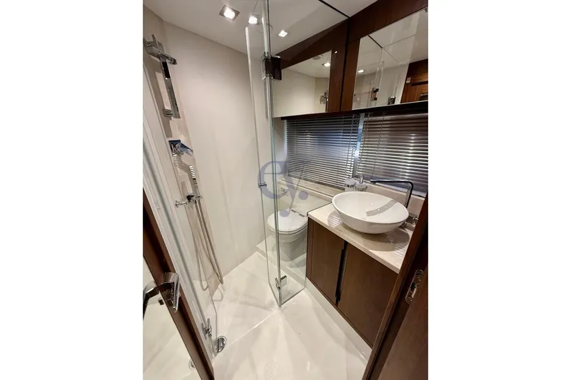  Yacht Photos Pics Luxurious bathroom in 2022 Galeon 460 Fly yacht with modern fixtures and elegant design.