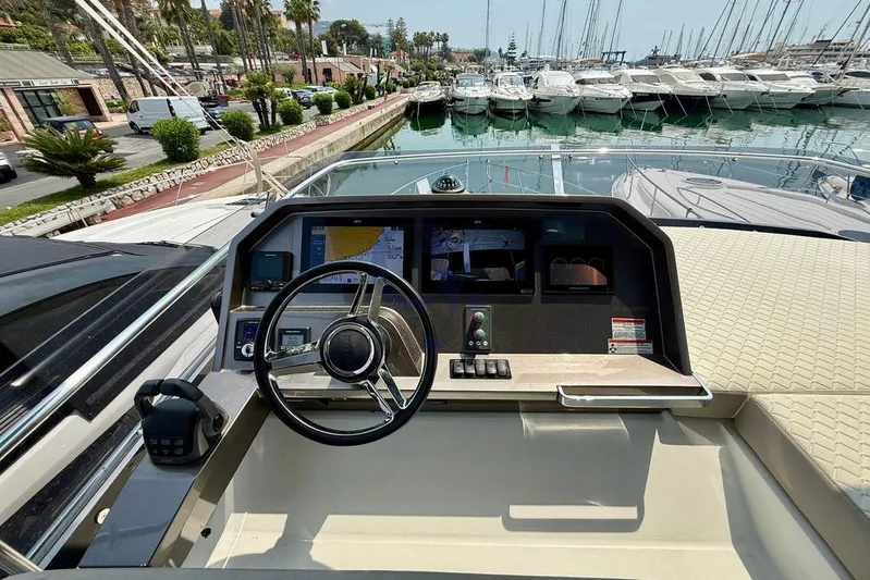  Yacht Photos Pics Helm of 2022 Galeon 460 Fly yacht with marina view.