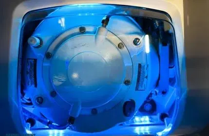  Yacht Photos Pics 2023 Extreme Boats 745 Game King engine, illuminated in blue light, showcasing mechanical details.