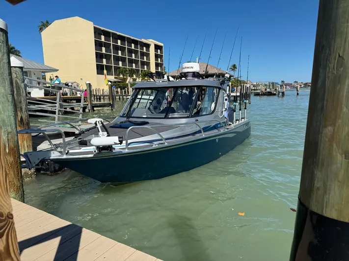  Yacht Photos Pics 2023 Extreme Boats 745 Game King docked in a sunny marina setting.