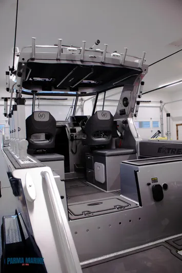  Yacht Photos Pics 2023 Extreme Boats 745 Game King interior with modern seating and controls.