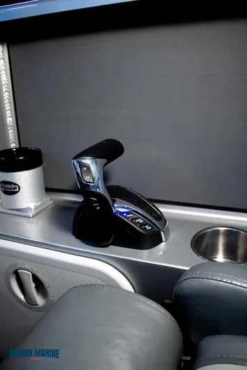  Yacht Photos Pics 2023 Extreme Boats 745 Game King interior with throttle control and cup holders.