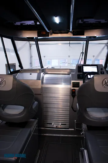  Yacht Photos Pics 2023 Extreme Boats 745 Game King interior with modern dashboard and seating.