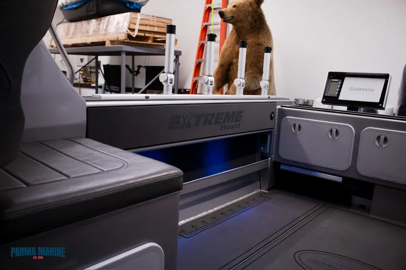  Yacht Photos Pics 2023 Extreme Boats 745 Game King interior with seating, rod holders, and Garmin display.