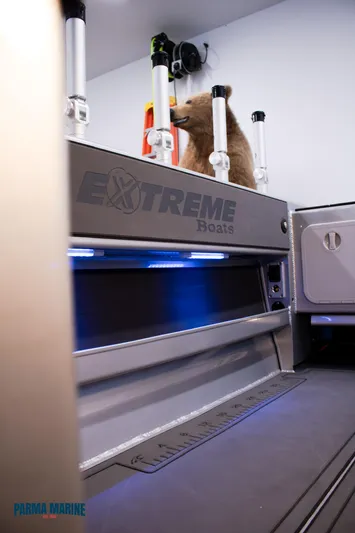  Yacht Photos Pics 2023 Extreme Boats 745 Game King interior with fishing rod holders and storage.