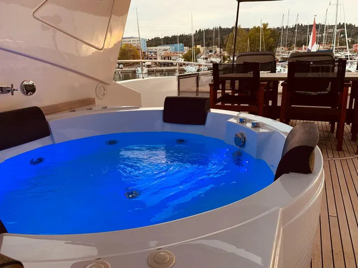  Yacht Photos Pics Luxurious jacuzzi on 2008 Conam 75 Widebody yacht with marina view.
