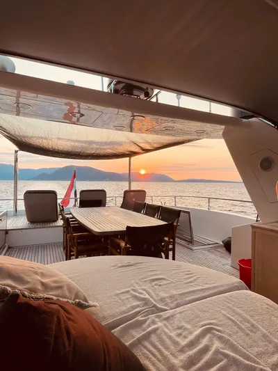  Yacht Photos Pics Luxury 2008 Conam 75 Widebody yacht interior with sunset view over the ocean.