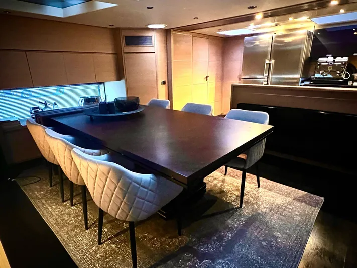  Yacht Photos Pics Luxurious dining area inside a 2008 Conam 75 Widebody yacht, featuring elegant seating and modern decor.