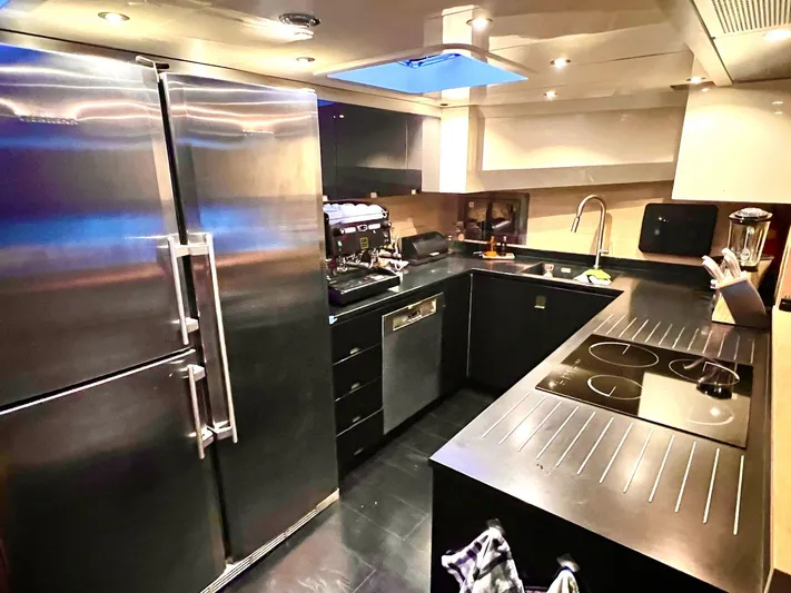  Yacht Photos Pics Luxurious kitchen interior of 2008 Conam 75 Widebody yacht with modern appliances.