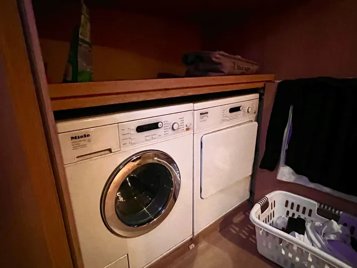  Yacht Photos Pics Laundry area with Miele washer and dryer on Conam 75 Widebody yacht, 2008 model.