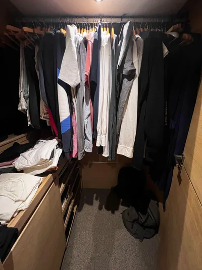  Yacht Photos Pics Closet with assorted clothing on hangers inside a Conam 75 Widebody yacht, 2008 model.