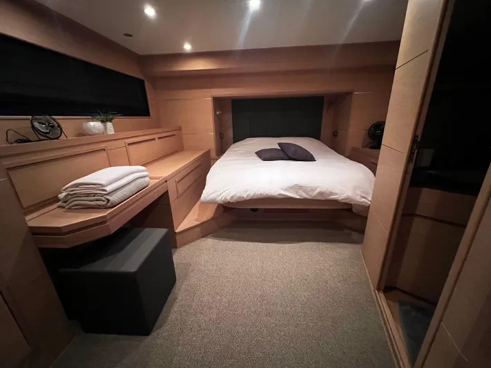  Yacht Photos Pics Luxurious bedroom interior of 2008 Conam 75 Widebody yacht with modern design and cozy bedding.