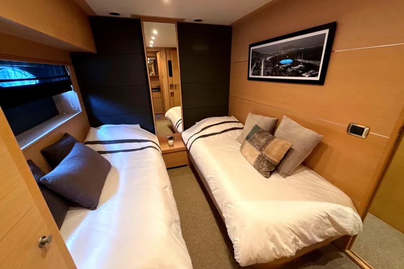  Yacht Photos Pics Luxurious cabin interior of 2008 Conam 75 Widebody yacht with twin beds and modern decor.