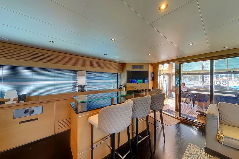  Yacht Photos Pics Luxurious interior of 2008 Conam 75 Widebody yacht with modern bar and seating area.