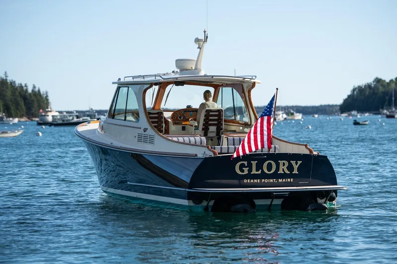 Glory Yacht Photos Pics 2013 Hinckley Talaria 34 boat "Glory" on serene water, Deane Point, Maine.
