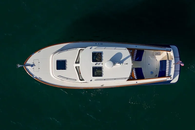 Glory Yacht Photos Pics Aerial view of 2013 Hinckley Talaria 34 yacht on calm water.