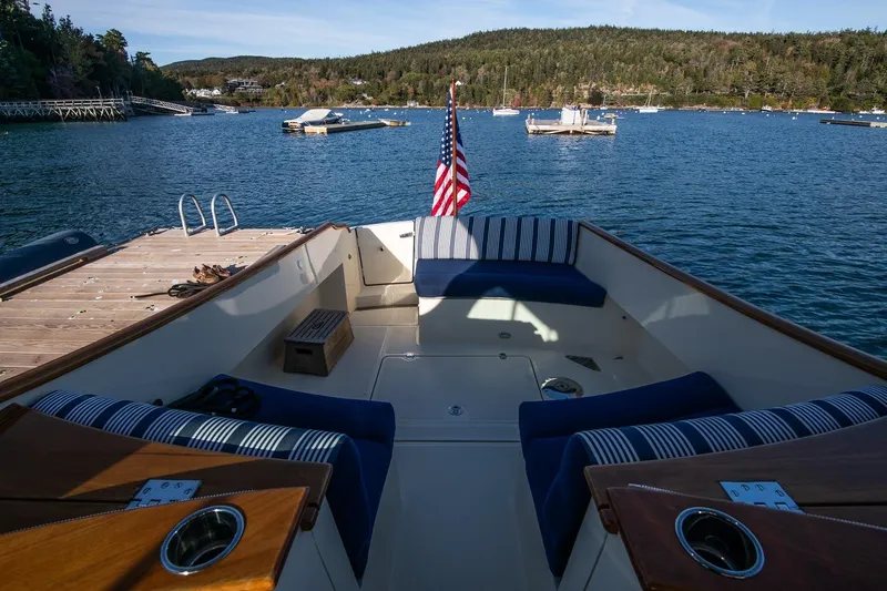 Glory Yacht Photos Pics Hinckley Talaria 34 boat interior, 2013 model, docked in scenic harbor with American flag.