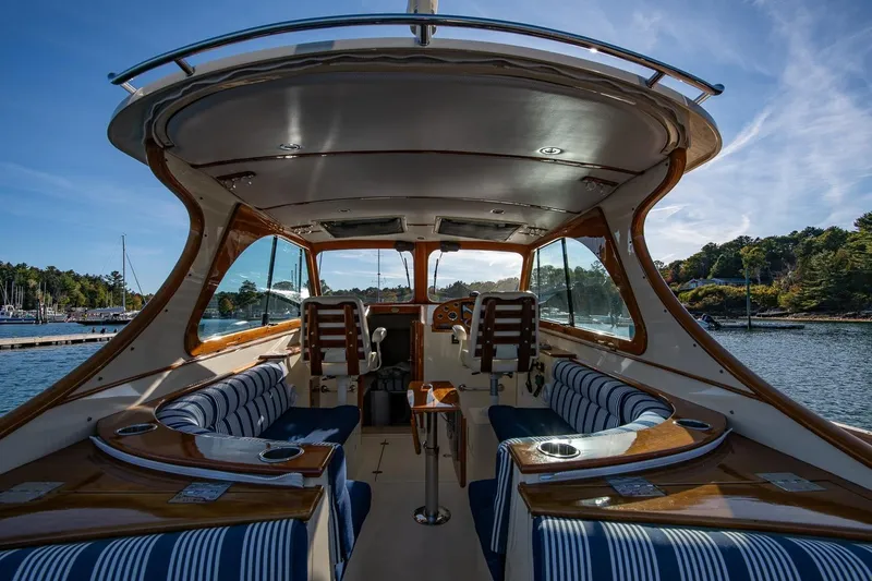 Glory Yacht Photos Pics Interior view of 2013 Hinckley Talaria 34 yacht with elegant seating and wood finishes.