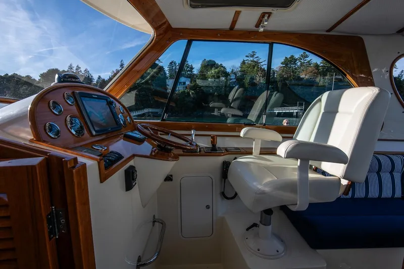 Glory Yacht Photos Pics Interior of 2013 Hinckley Talaria 34 yacht with luxurious helm and seating.