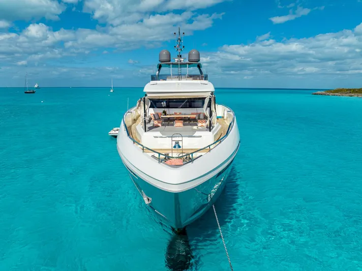 Fifi Yacht Photos Pics Luxurious 2018 Custom Line Navetta 33 yacht anchored in clear turquoise waters.