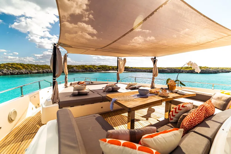 Fifi Yacht Photos Pics Luxurious 2018 Custom Line Navetta 33 yacht deck with elegant seating and ocean view.