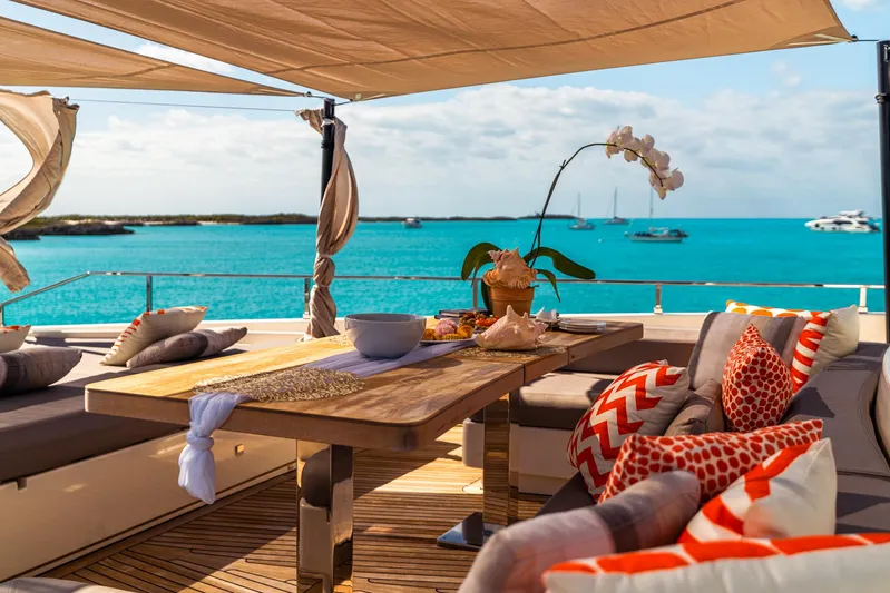 Fifi Yacht Photos Pics Luxurious 2018 Custom Line Navetta 33 yacht deck with elegant seating and ocean view.