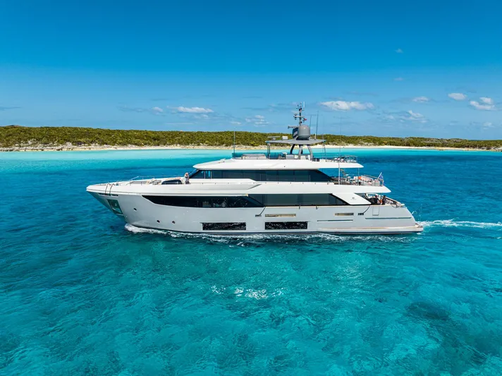 Fifi Yacht Photos Pics Luxurious 2018 Custom Line Navetta 33 yacht cruising in clear turquoise waters.