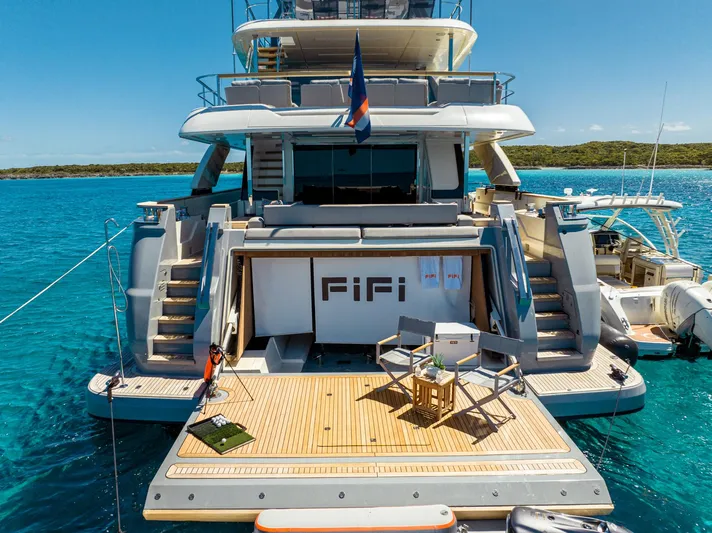 Fifi Yacht Photos Pics Luxurious 2018 Custom Line Navetta 33 yacht docked in clear blue waters.