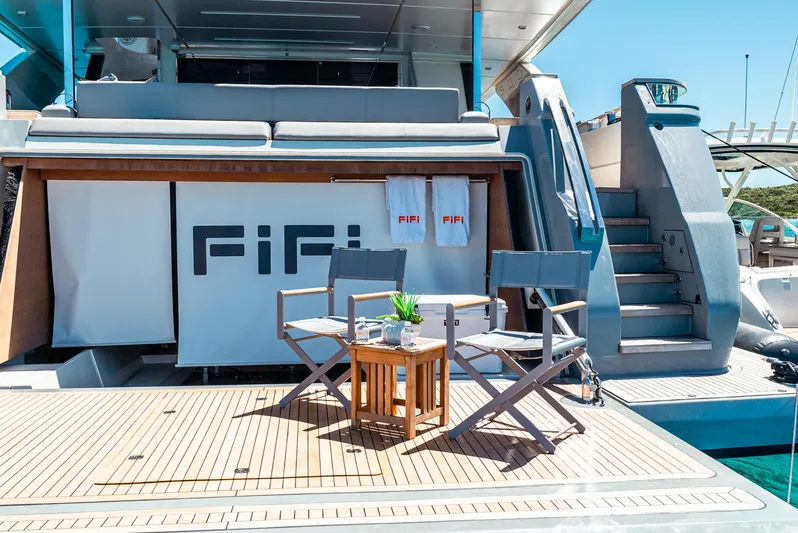 Fifi Yacht Photos Pics Luxurious 2018 Custom Line Navetta 33 yacht deck with chairs and table setup.