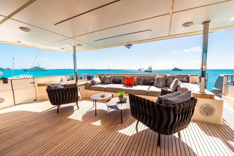 Fifi Yacht Photos Pics Luxurious 2018 Custom Line Navetta 33 yacht deck with elegant seating and ocean view.