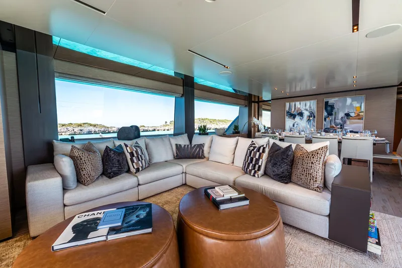 Fifi Yacht Photos Pics Luxurious interior of 2018 Custom Line Navetta 33 yacht with plush seating and elegant decor.