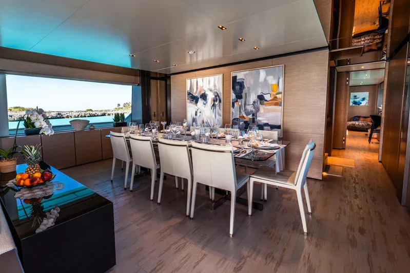 Fifi Yacht Photos Pics Luxurious dining area on 2018 Custom Line Navetta 33 yacht with elegant decor and sea view.