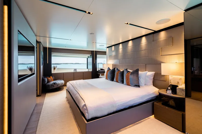 Fifi Yacht Photos Pics Luxurious bedroom interior on 2018 Custom Line Navetta 33 yacht, featuring modern design and large windows.