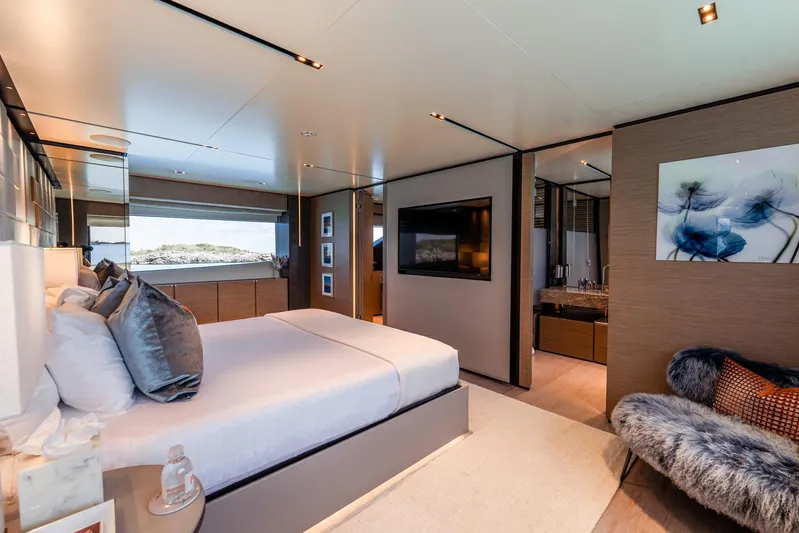 Fifi Yacht Photos Pics Luxurious bedroom interior on 2018 Custom Line Navetta 33 yacht, featuring modern decor and ocean view.