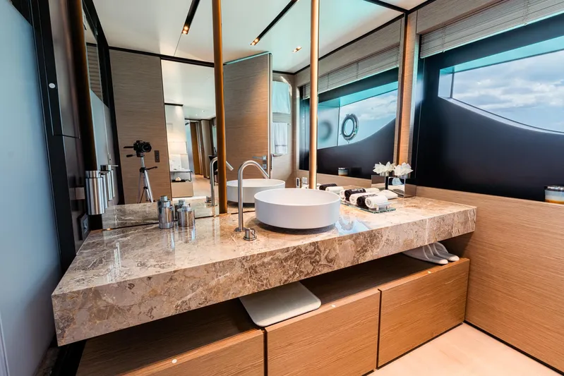 Fifi Yacht Photos Pics Luxurious bathroom on 2018 Custom Line Navetta 33 yacht with marble countertop and modern fixtures.