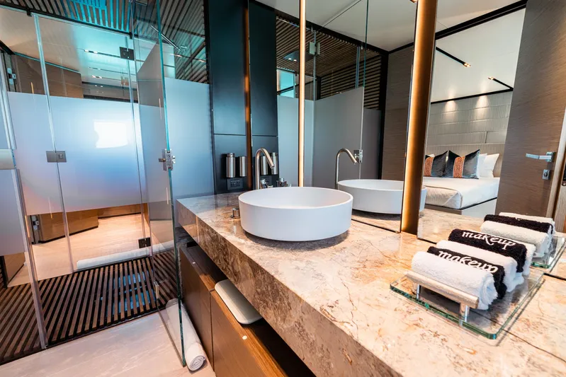 Fifi Yacht Photos Pics Luxurious bathroom on 2018 Custom Line Navetta 33 yacht with modern sink and elegant decor.
